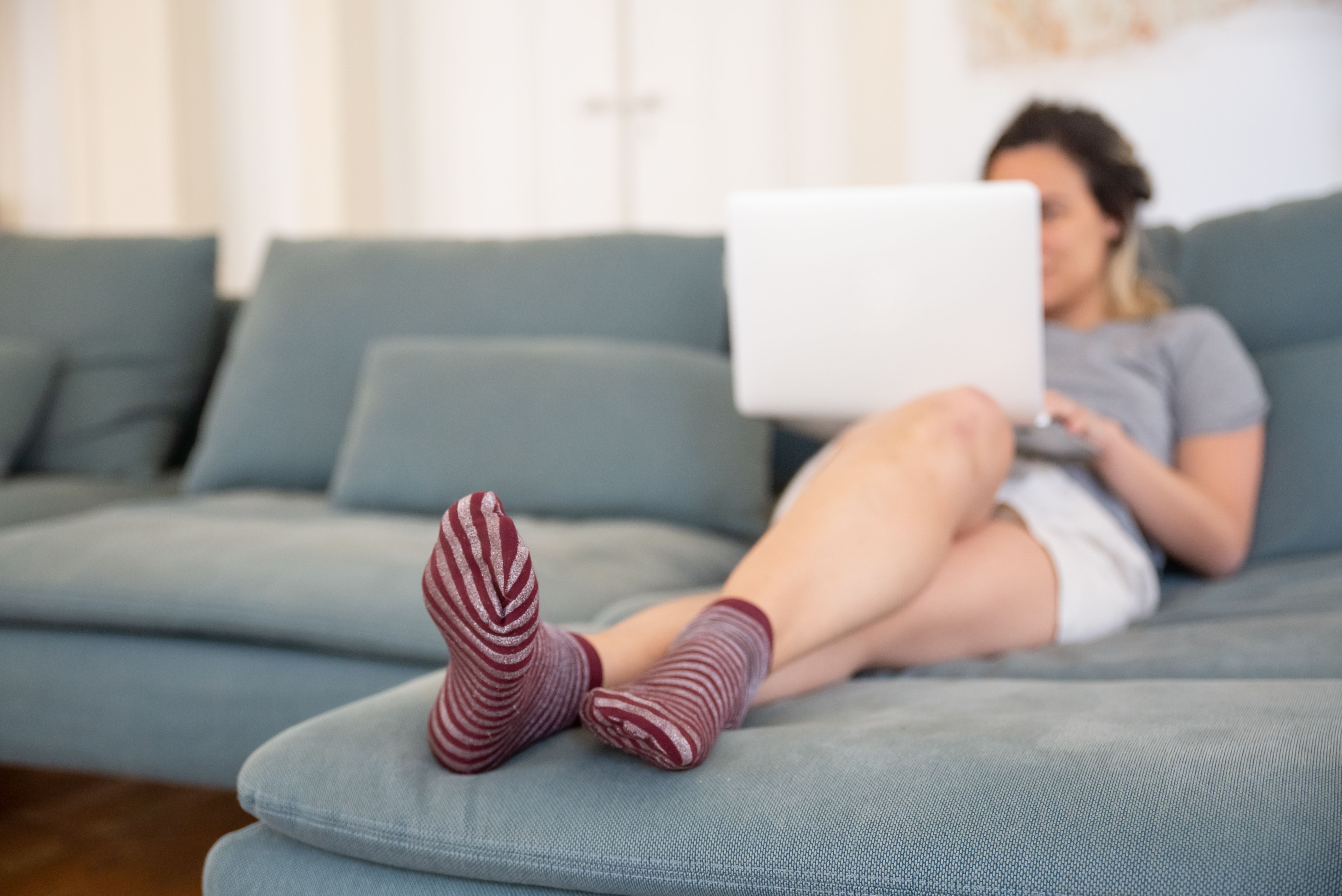 person browsing laptop in cozy private setting - can you get health insurance quote without giving personal information