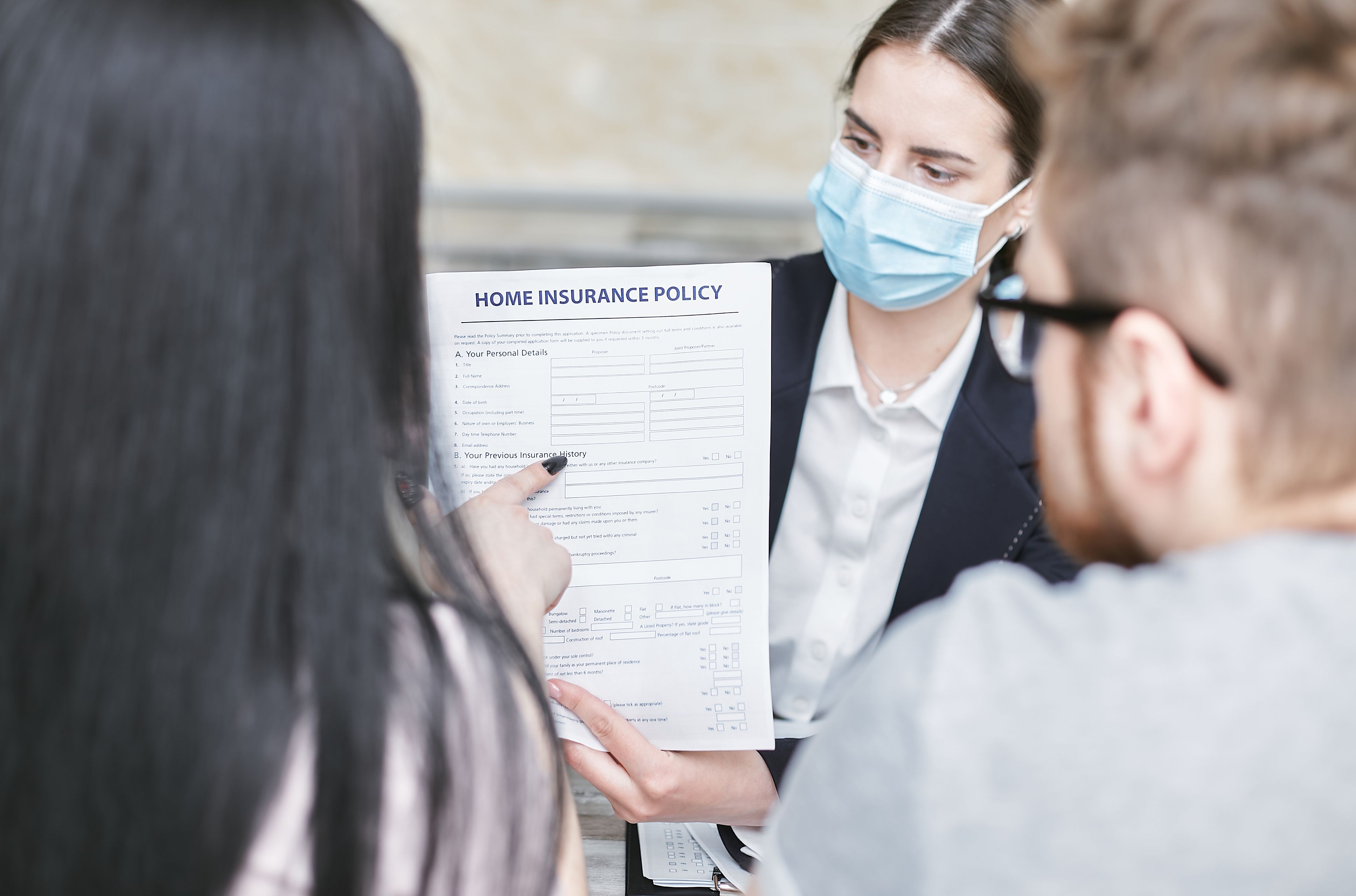 insurance agent explaining a policy to a client - auto insurance coverage