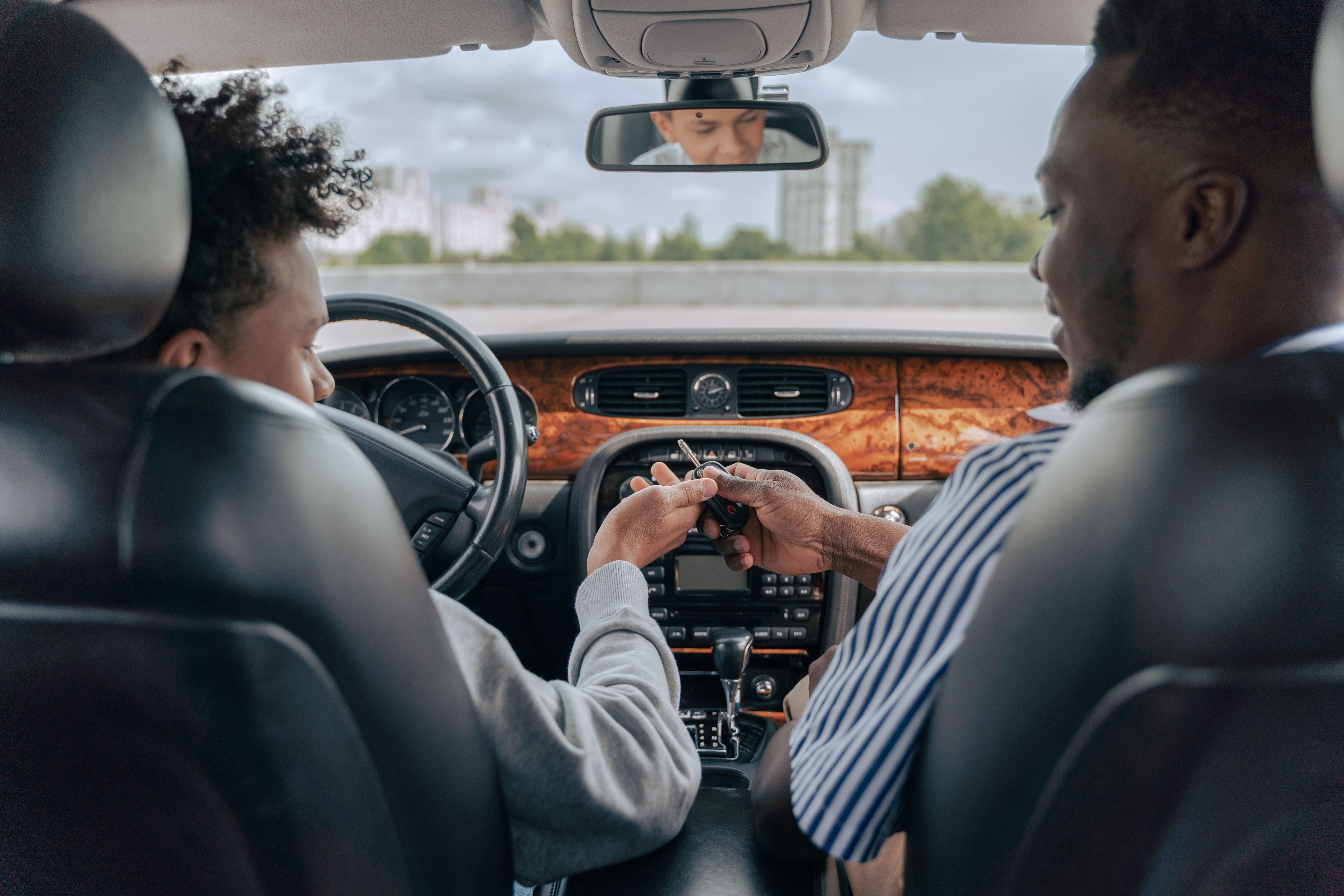 Teen driver and senior driver comparing insurance options - Reading PA car insurance Teen driver and senior driver comparing insurance options - Reading PA car insurance