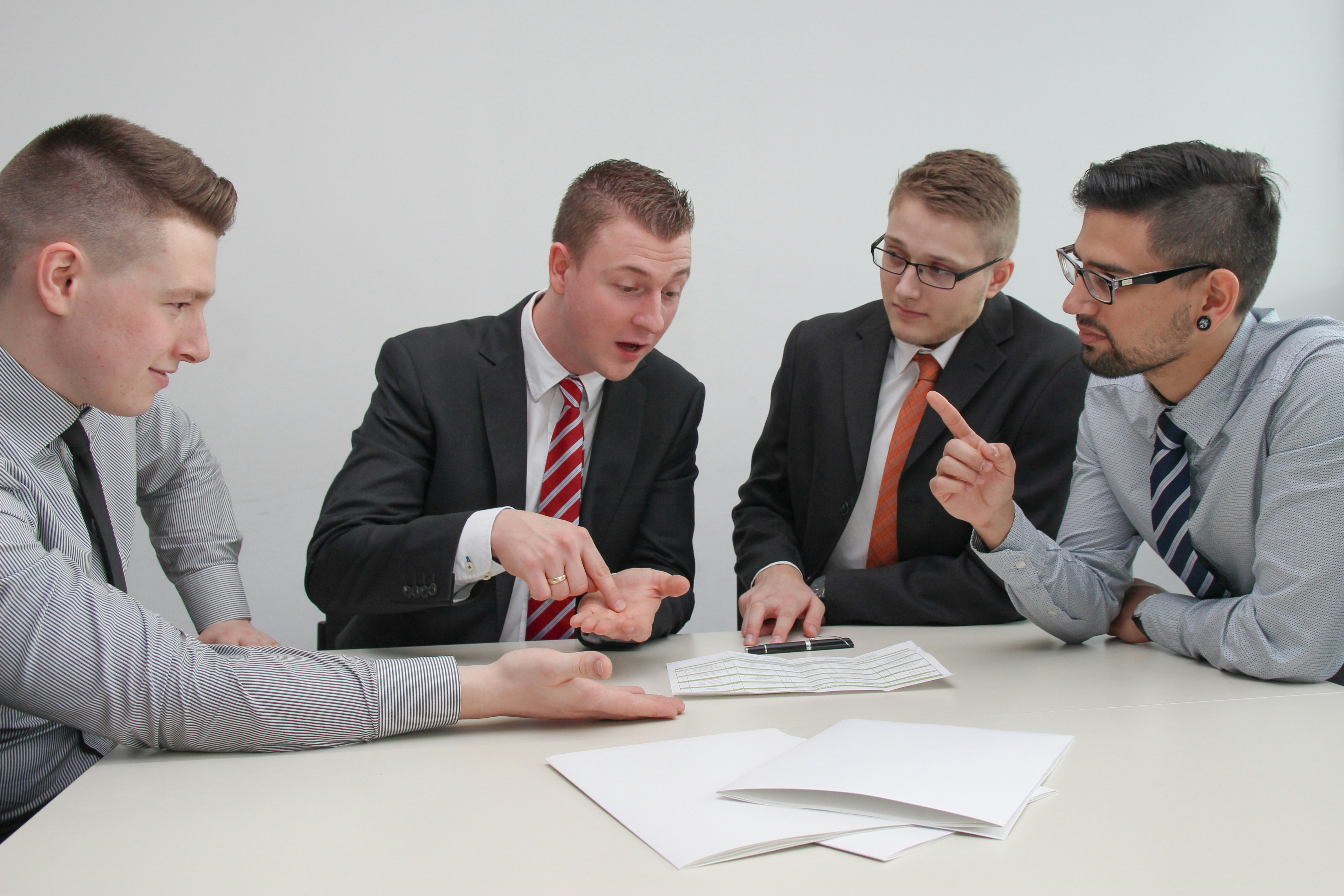 Insurance agent and client reviewing a policy in a comfortable office setting - 6 car insurance discounts you should ask Insurance agent and client reviewing a policy in a comfortable office setting - 6 car insurance discounts you should ask