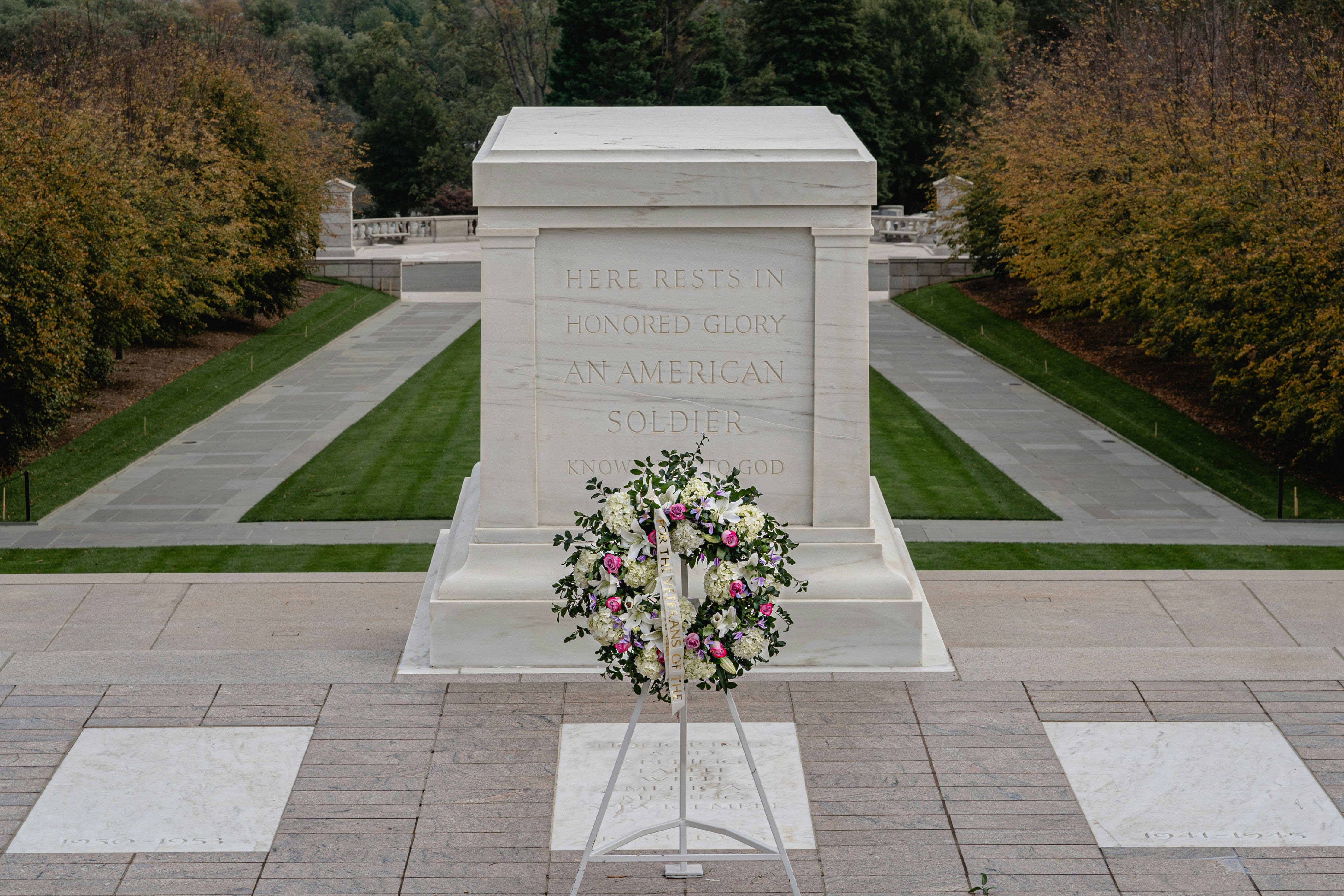 A peaceful memorial service setting with floral arrangements - funeral expense coverage
