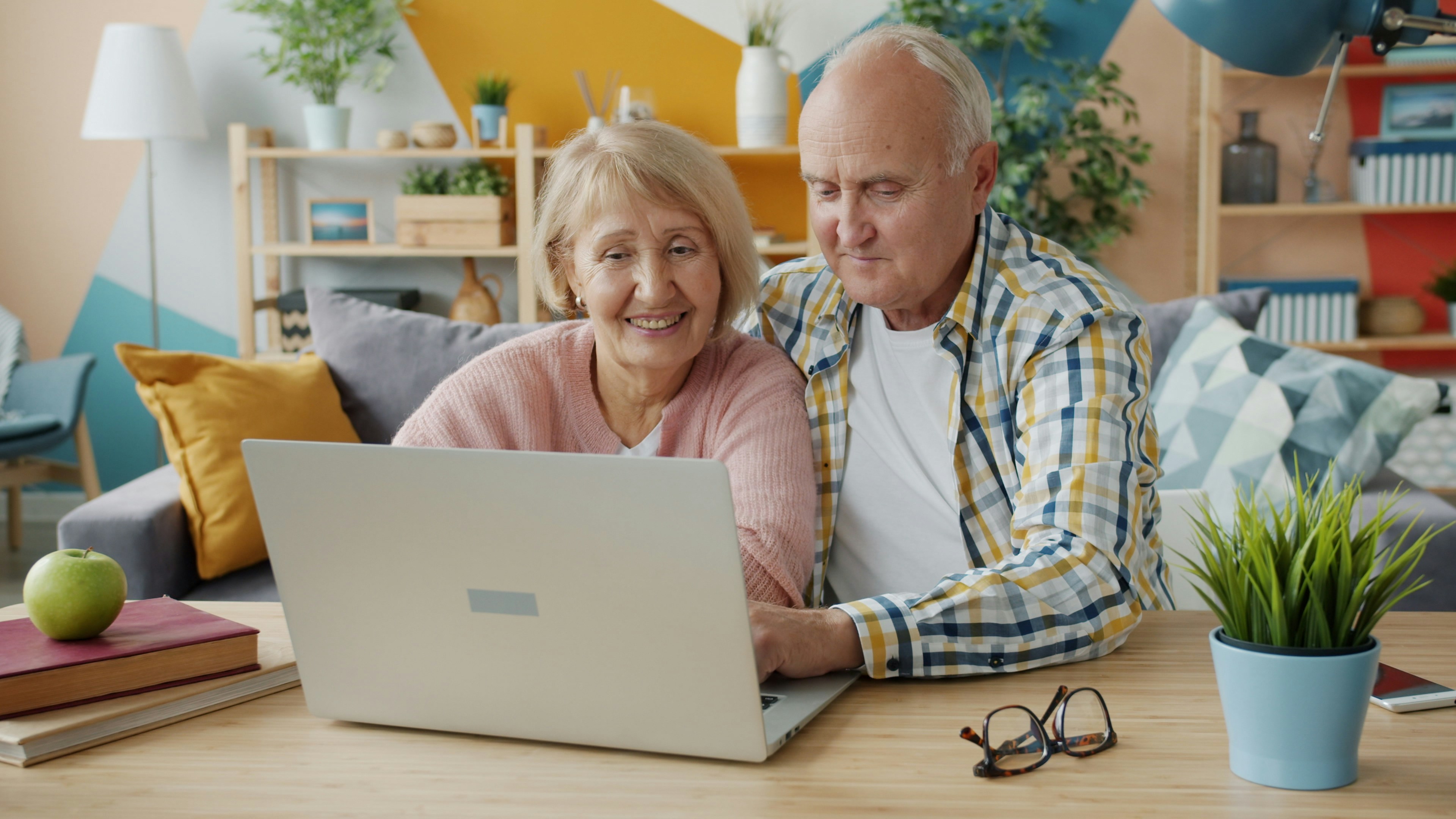 A senior using a laptop to securely manage their life insurance account A senior using a laptop to securely manage their life insurance account