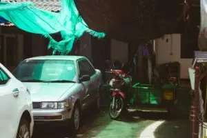 car and motorcycle parked together